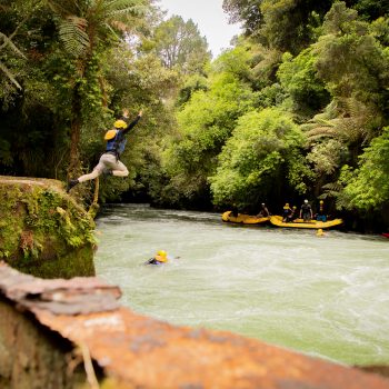 Jumping from a cliff rafting in New Zealand